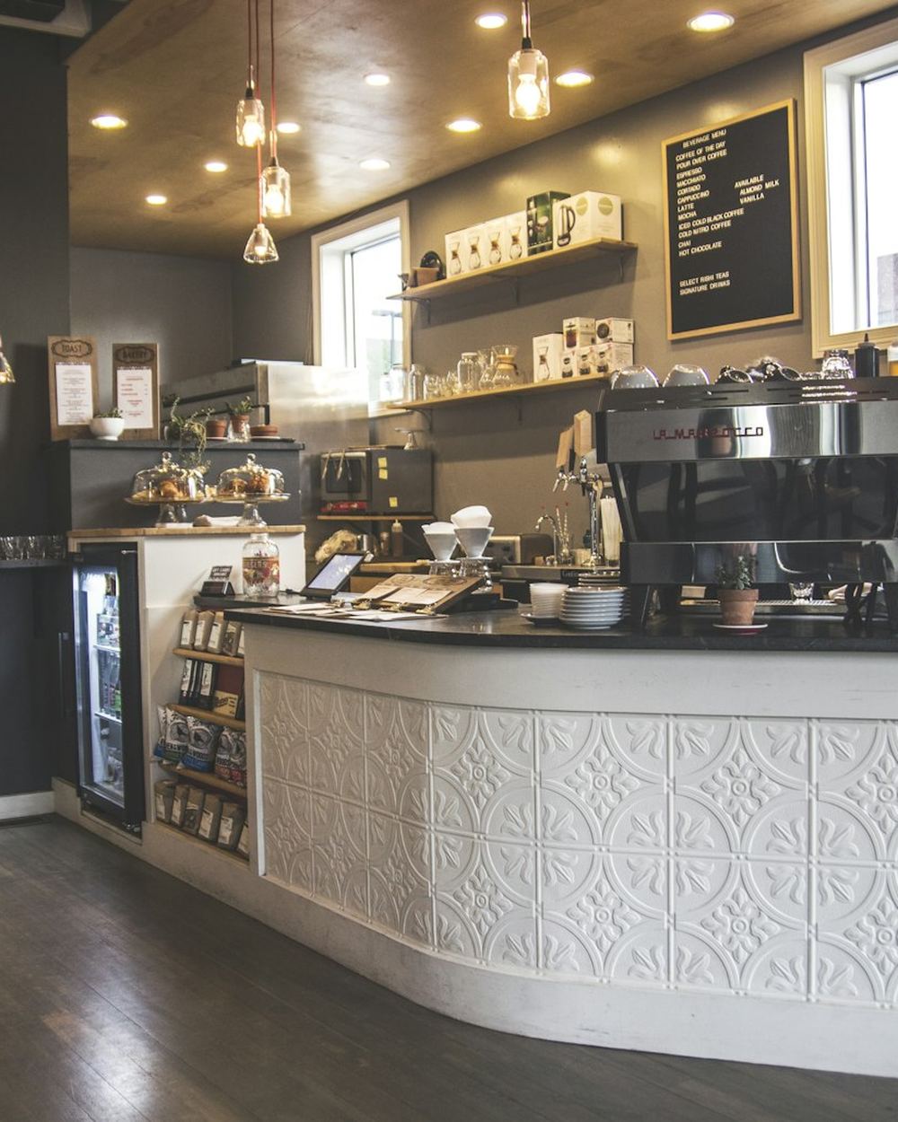 A coffee shop interior with espresso machines