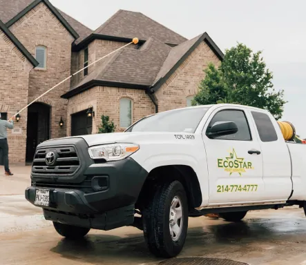 Ecostar Pest Control service truck outside a home